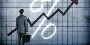 Why is it important for the Fed to raise interest rates?